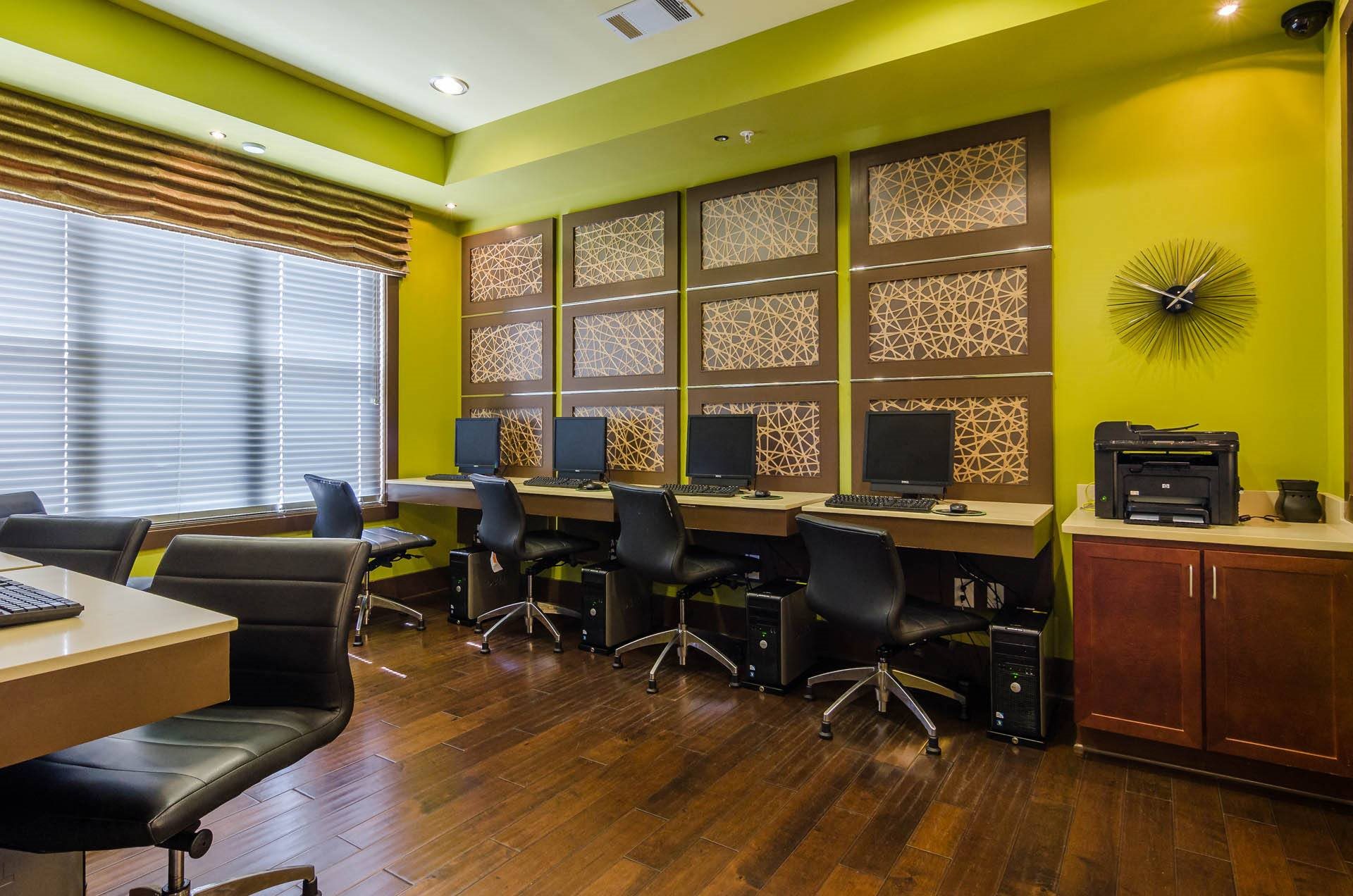Computer Café Computer room featuring great lighting, seven desktop computers, and printer at Ashley Auburn Pointe In Atlanta, GA